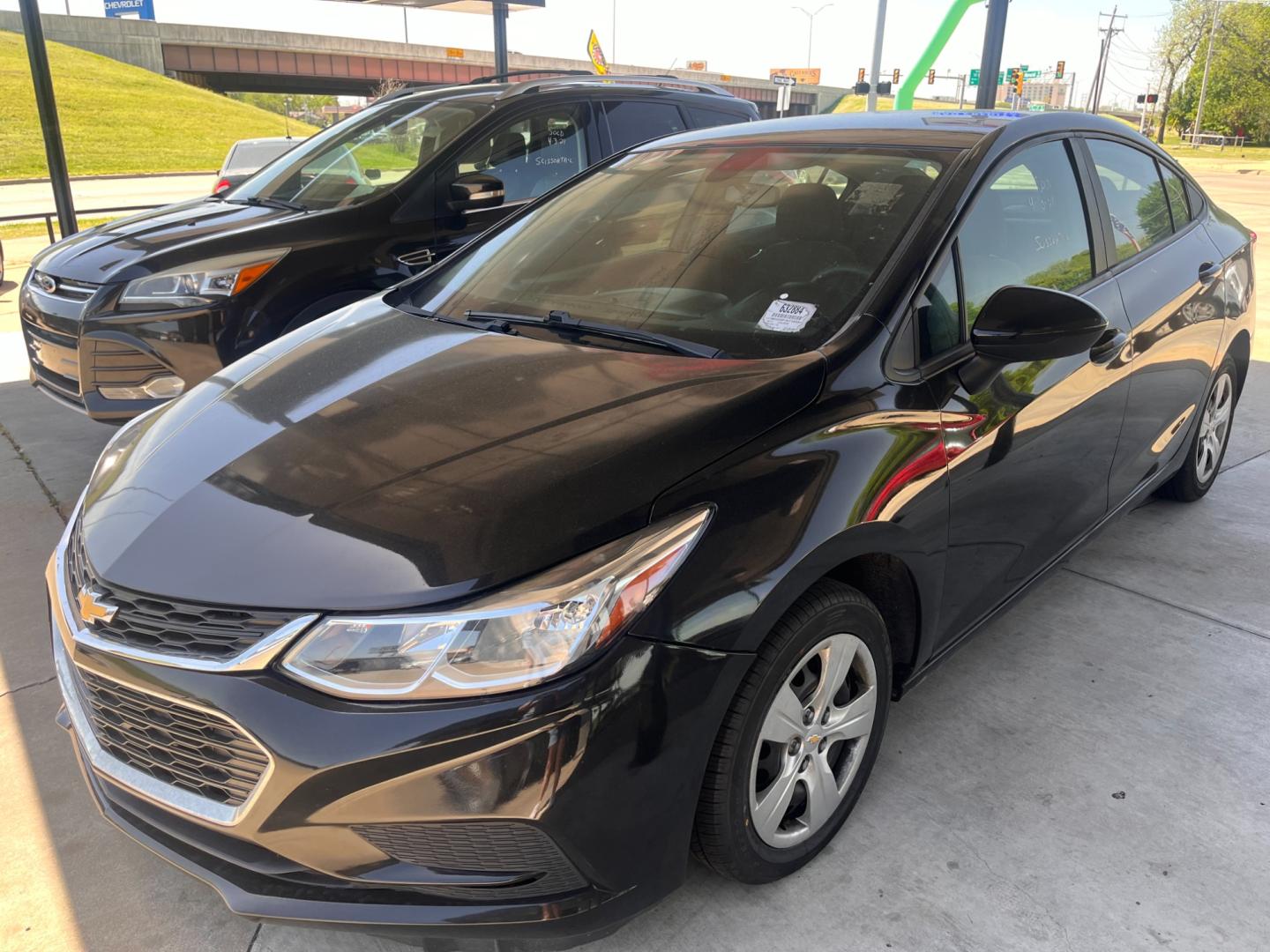 2017 BLACK CHEVROLET CRUZE LS LS Auto (1G1BC5SM1H7) with an 1.4L L4 DOHC 16V TURBO engine, 6A transmission, located at 8101 E. Skelly Dr., Tulsa, OK, 74129, (918) 592-3593, 36.121891, -95.888802 - Photo#0